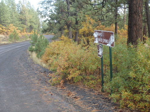 GDMBR: A Road Sign showing the direction and distance to Grants (14 Miles).